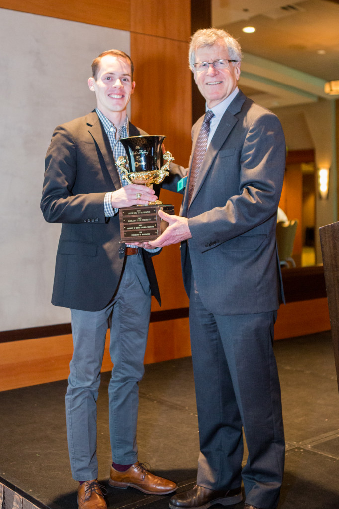 MSRE candidate '14 Eric Hadden with John Teutsch, site sponsor and owner of Mariners Square