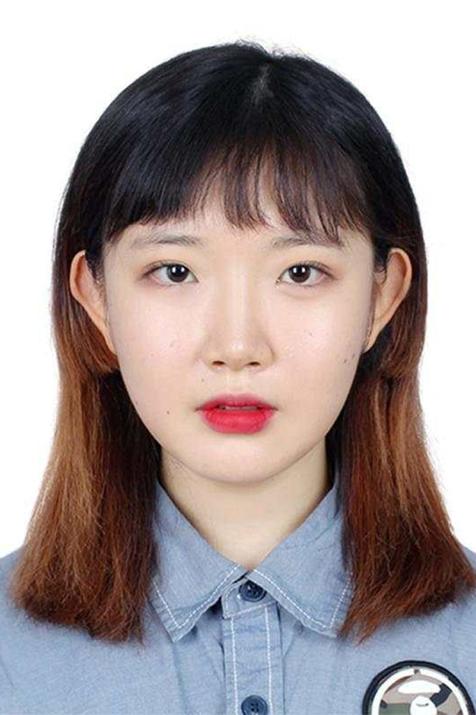 girl with red lipstick, bangs, and a blue button up shirt set against a white background