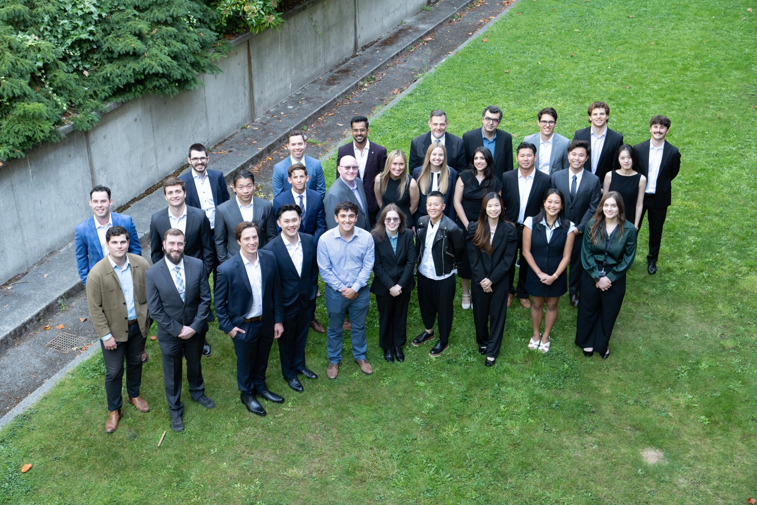 Students sitting and standing in a group